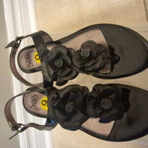 Flower adorned black sandals